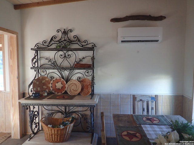 interior details featuring beam ceiling and an AC wall unit