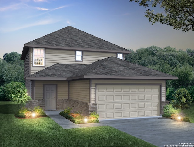 view of front property featuring a yard and a garage