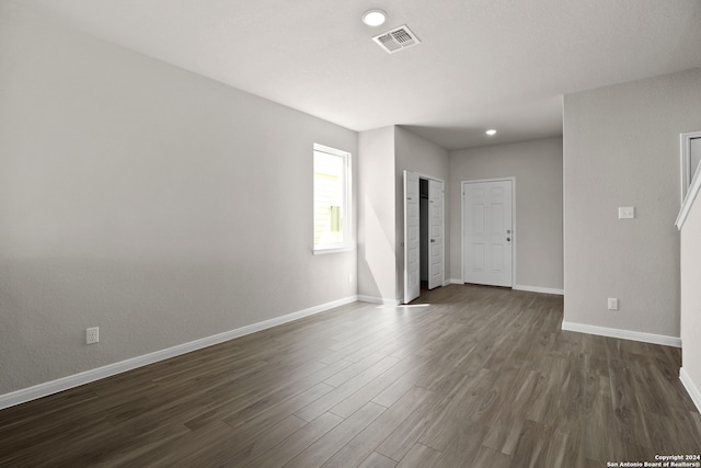 spare room with dark hardwood / wood-style flooring