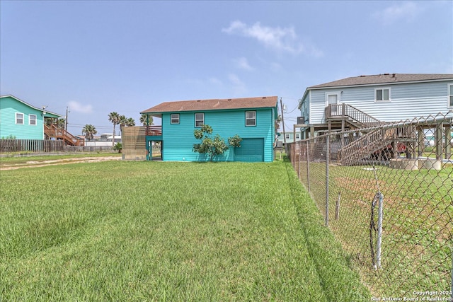 back of property featuring a lawn