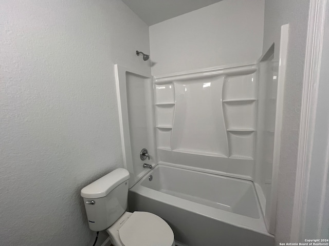 bathroom featuring bathing tub / shower combination and toilet