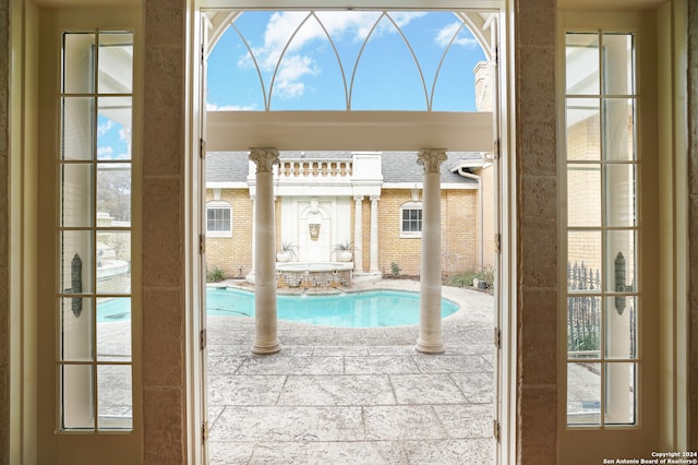 view of swimming pool with a patio