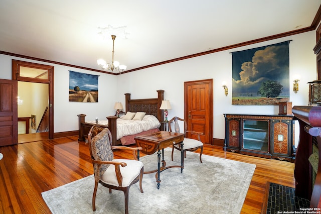 bedroom with wood-type flooring, a chandelier, and ornamental molding