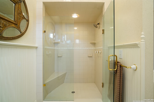 bathroom with a shower with shower door