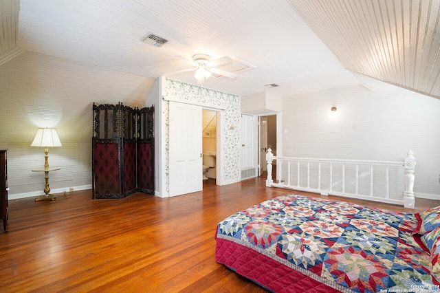 bedroom with ceiling fan, hardwood / wood-style flooring, and vaulted ceiling