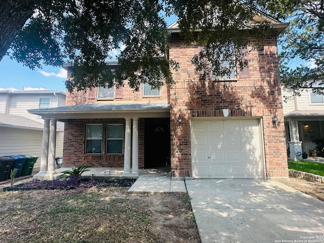 view of front of home featuring a garage and covered porch