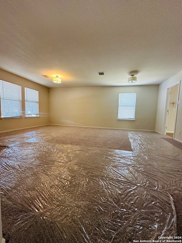 spare room featuring a textured ceiling