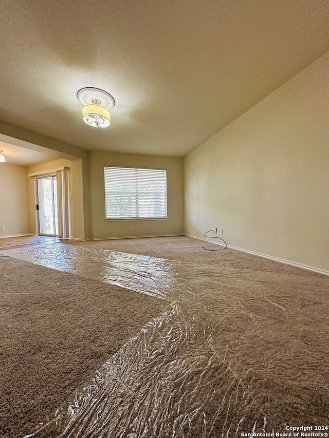 empty room with a textured ceiling