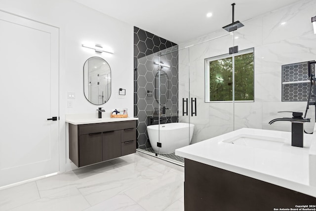 bathroom featuring shower with separate bathtub, tile walls, and vanity