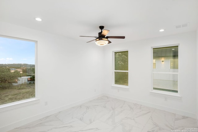 spare room featuring ceiling fan