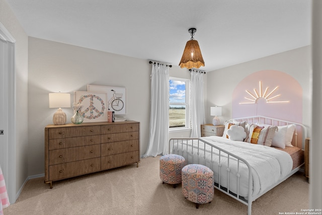 bedroom featuring light colored carpet