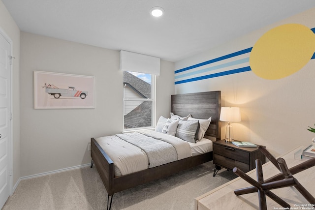 carpeted bedroom featuring baseboards and recessed lighting