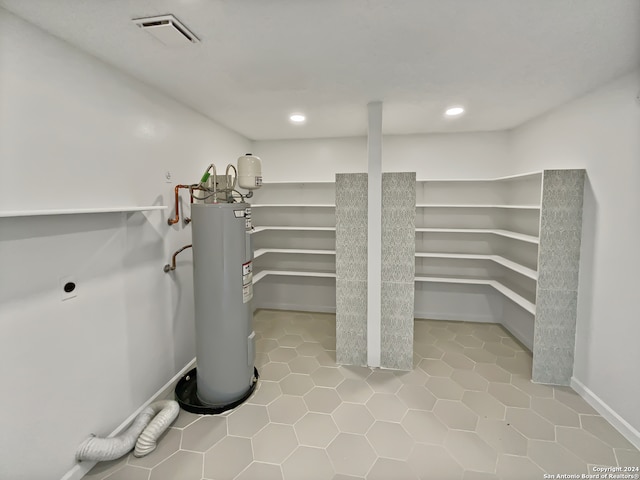 utility room with water heater