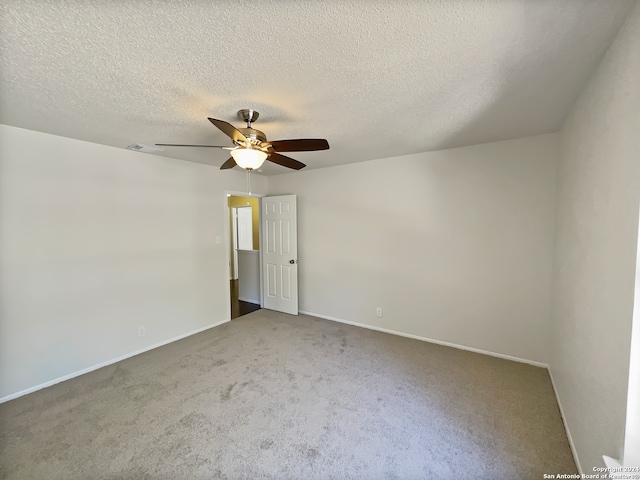 empty room with carpet, a textured ceiling, and ceiling fan