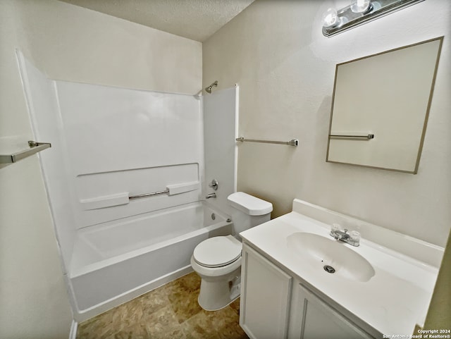 full bathroom featuring a textured ceiling, shower / washtub combination, vanity, and toilet