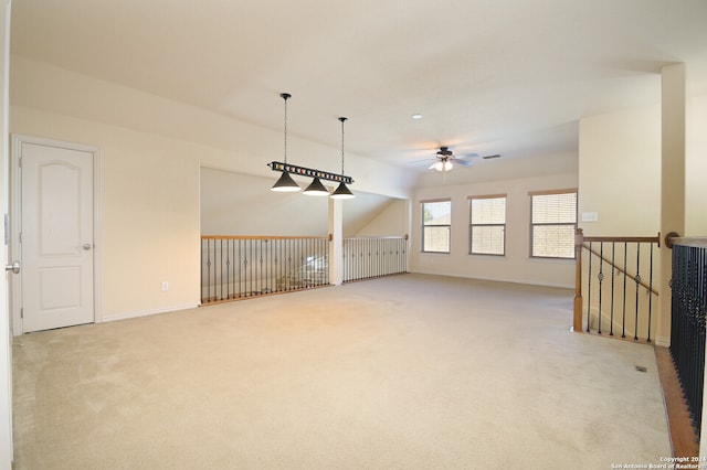 carpeted spare room with ceiling fan