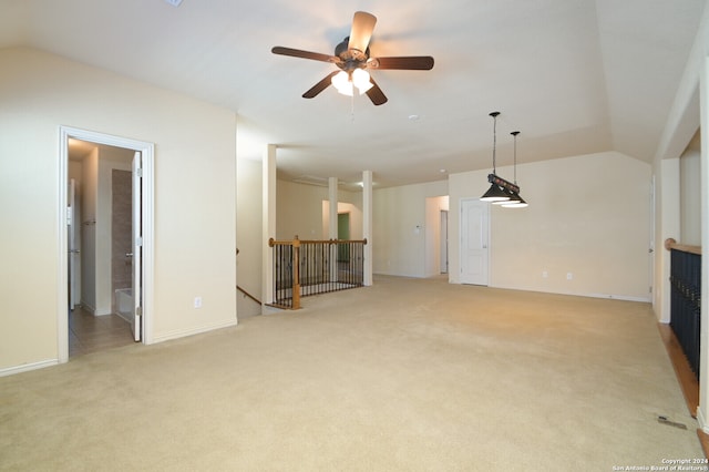 unfurnished living room with light carpet, vaulted ceiling, and ceiling fan