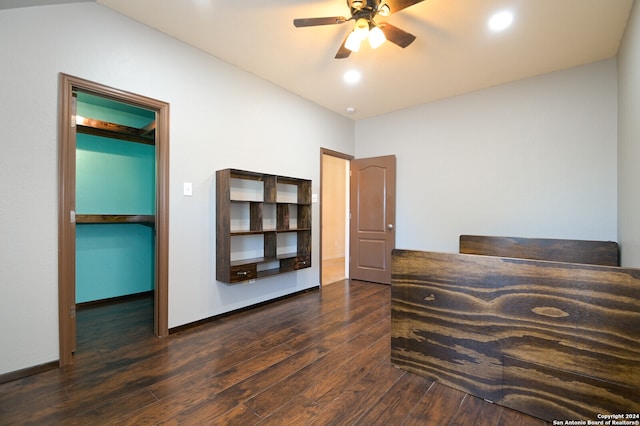 bedroom with ceiling fan and dark wood-type flooring