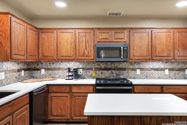 kitchen with decorative backsplash and black appliances