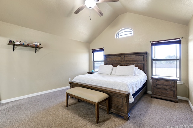 carpeted bedroom featuring lofted ceiling and ceiling fan