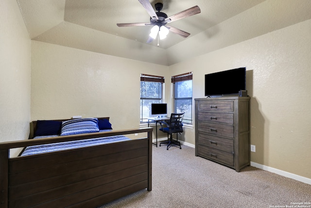 bedroom with ceiling fan, light colored carpet, a textured ceiling, and vaulted ceiling