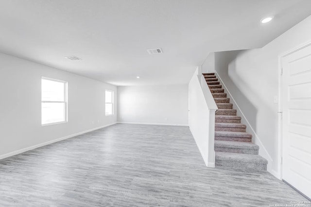 unfurnished living room with light wood-type flooring