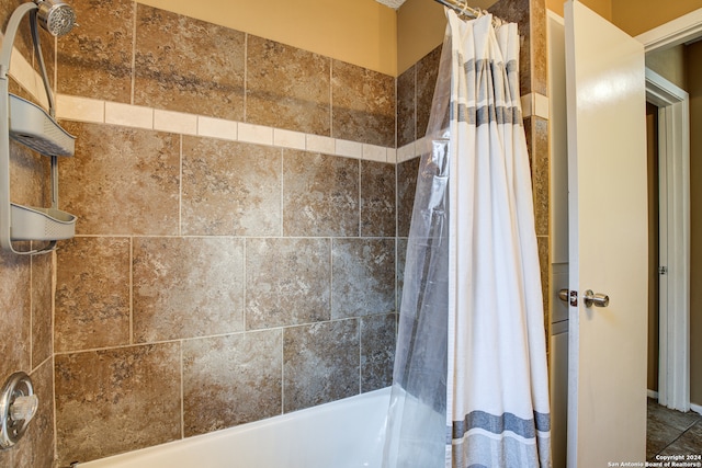 bathroom featuring shower / bathtub combination with curtain