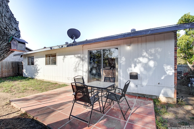 back of property featuring a patio