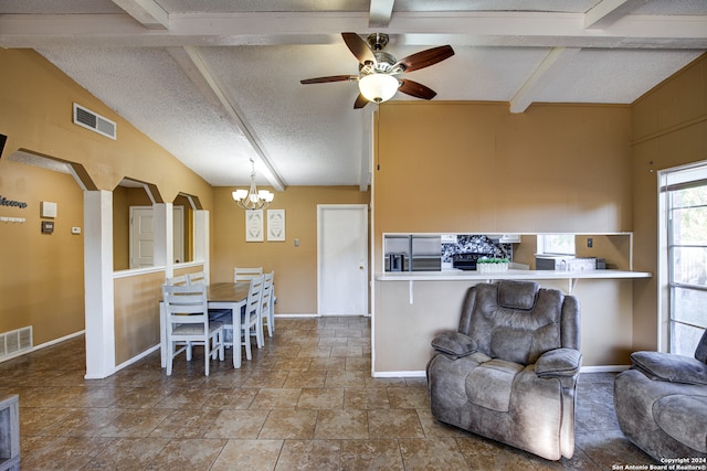 living room featuring vaulted ceiling with beams, a textured ceiling, and ceiling fan with notable chandelier