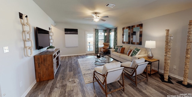 living room with ceiling fan, dark hardwood / wood-style flooring, and vaulted ceiling