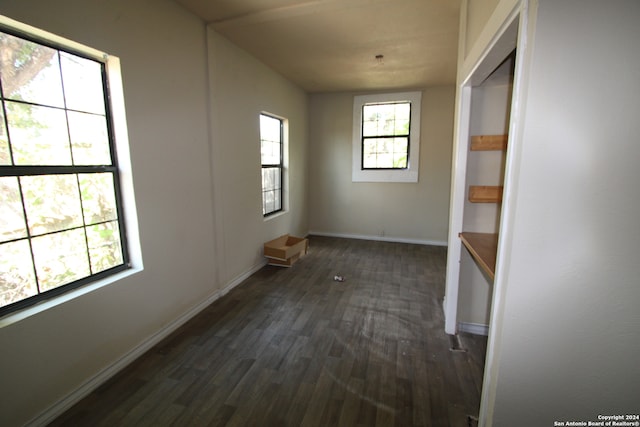 interior space with dark hardwood / wood-style flooring