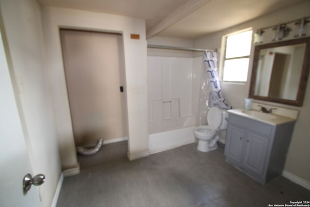 full bathroom with vanity, shower / bath combo with shower curtain, and toilet