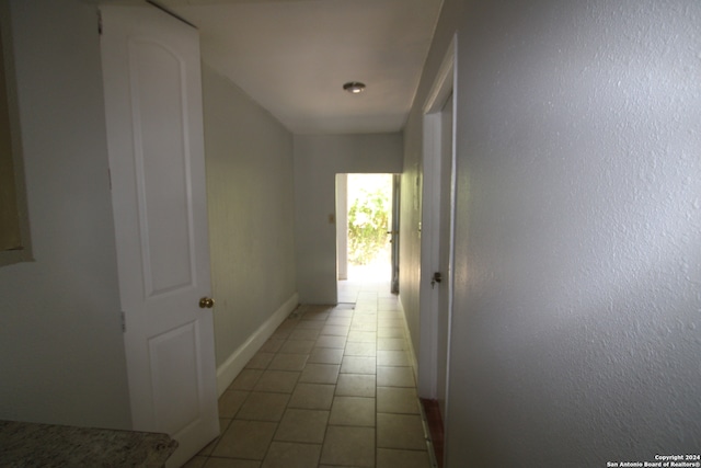 corridor featuring tile patterned flooring