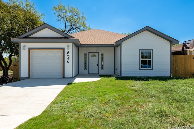 ranch-style house with a front yard and a garage