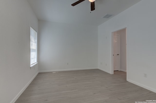 unfurnished room featuring ceiling fan and light hardwood / wood-style flooring