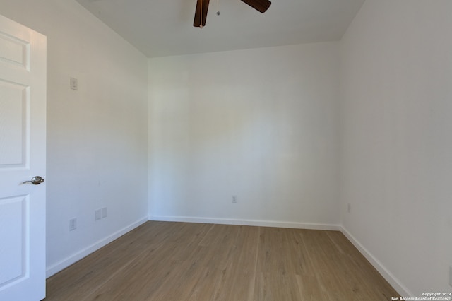 empty room with light hardwood / wood-style floors and ceiling fan