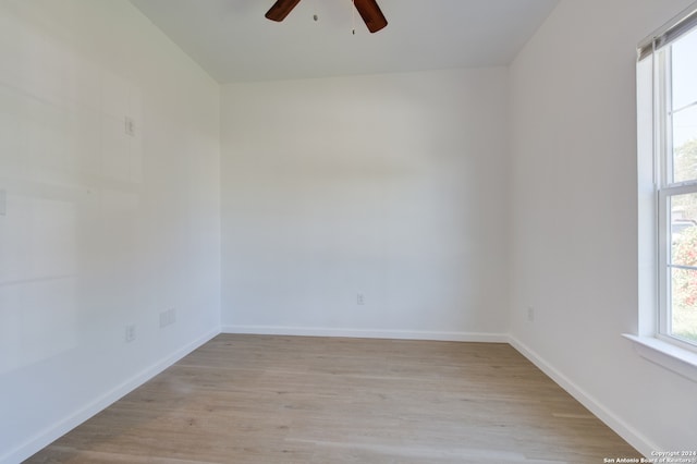 unfurnished room featuring ceiling fan and light hardwood / wood-style flooring