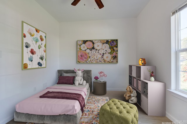 bedroom featuring light hardwood / wood-style flooring and ceiling fan