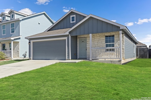 view of front facade featuring a garage and a front lawn