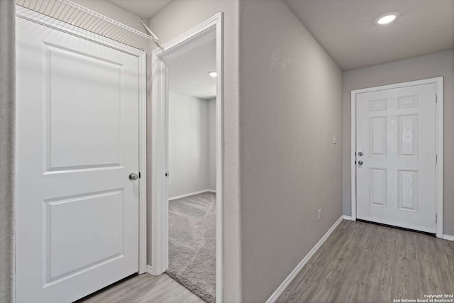 corridor featuring light hardwood / wood-style flooring