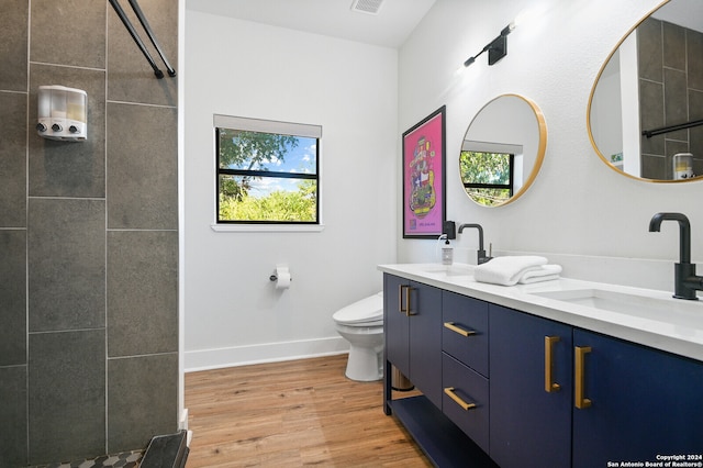 bathroom with vanity, hardwood / wood-style floors, and toilet