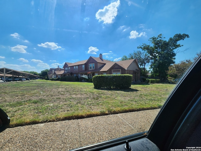 exterior space with a front lawn