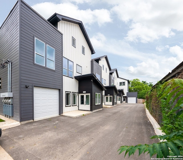 view of side of home featuring a garage