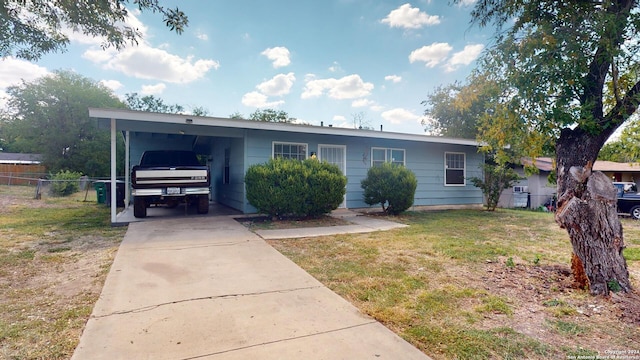 ranch-style house with a front lawn and a carport