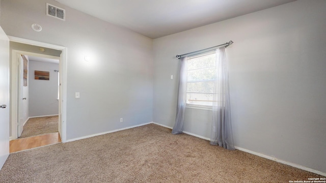 unfurnished room with carpet flooring