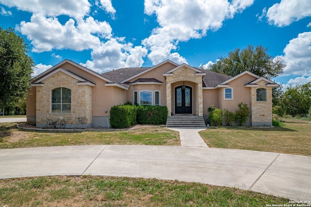 ranch-style house with a front lawn