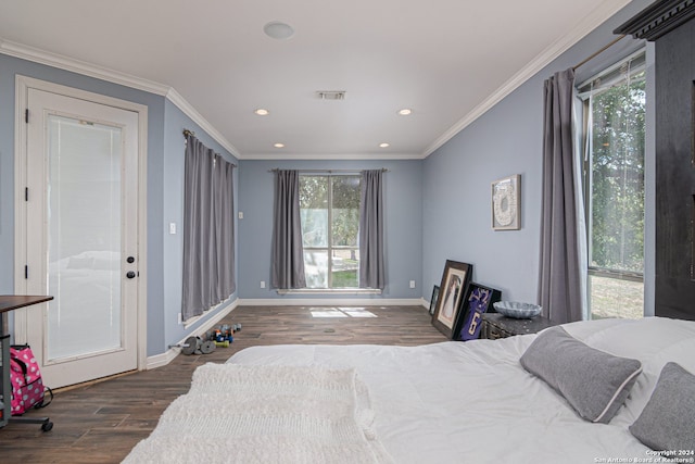 bedroom featuring multiple windows, dark wood-type flooring, and crown molding