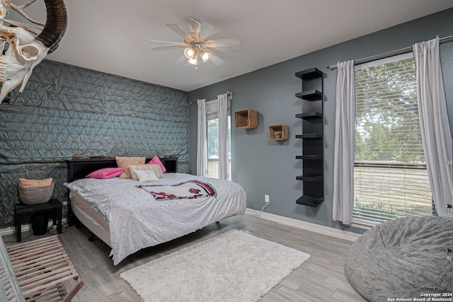 bedroom featuring ceiling fan and hardwood / wood-style floors