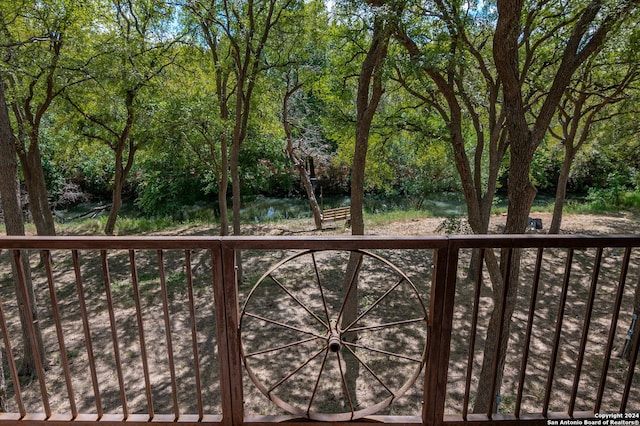 wooden deck with a water view