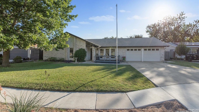 12743 S El Sonteo St, San Antonio, TX 78233 - view of front facade featuring a garage, concrete driveway, a front lawn, brick siding, and french doors